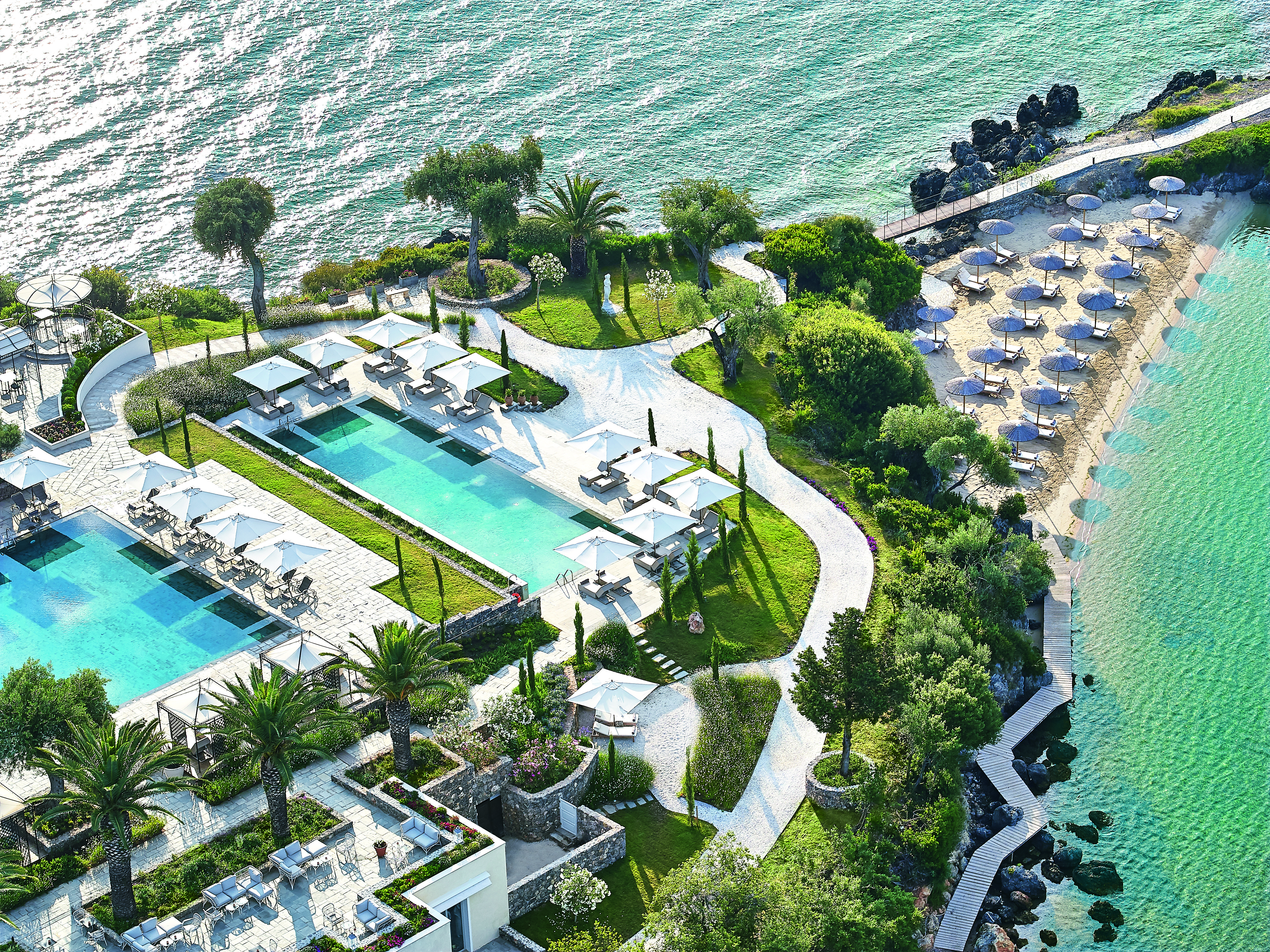Aerial of swimming pools and sea at the Corfu Imperial