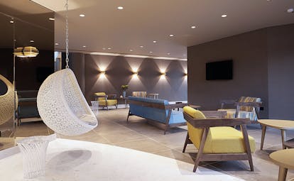 Domes of Elounda Greece lounge area with sofas and a hanging chair