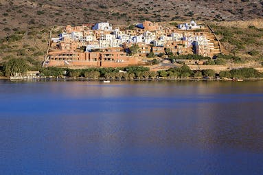 Domes of Elounda Greece panorama view of terracotta buildings from the sea
