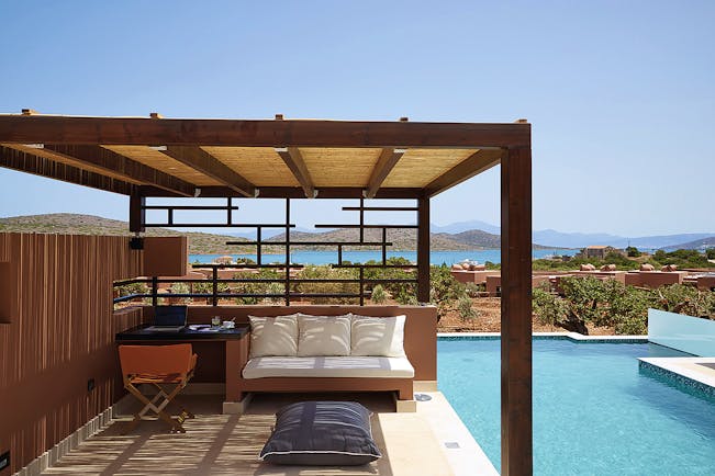 Domes of Elounda Greece  private pool veranda desk and sofa