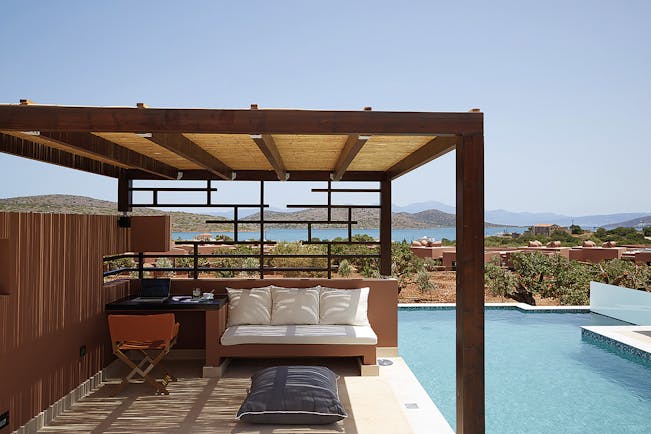 Domes of Elounda Greece  private pool veranda desk and sofa