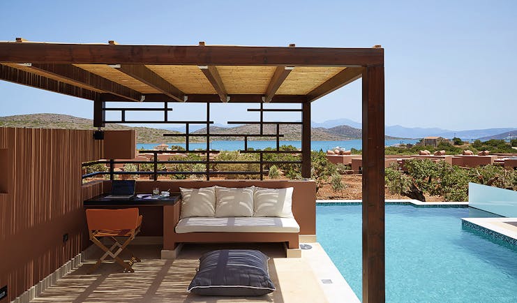 Domes of Elounda Greece  private pool veranda desk and sofa