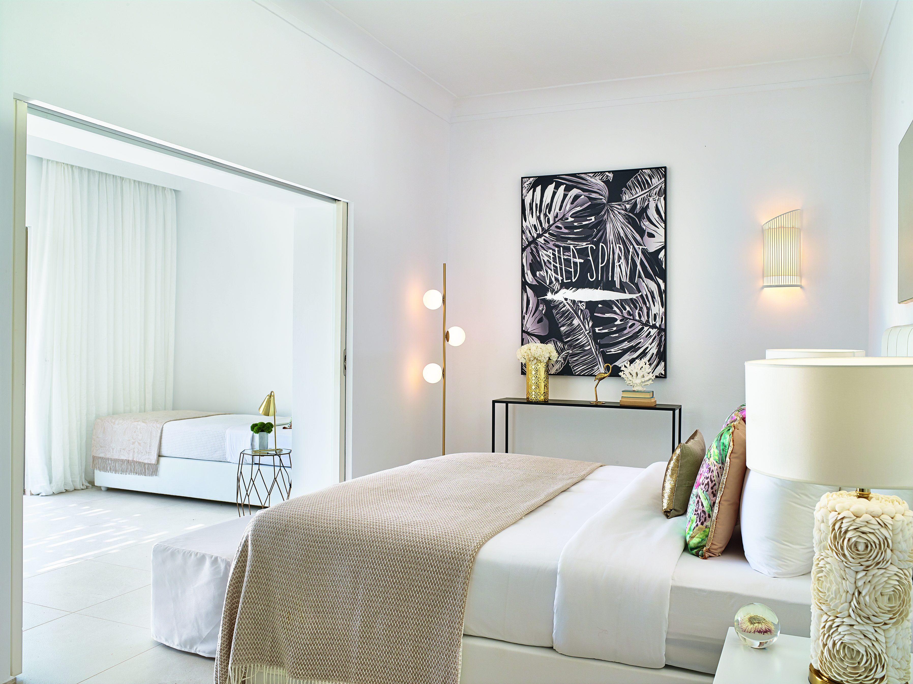 Cream and white room with extra bed