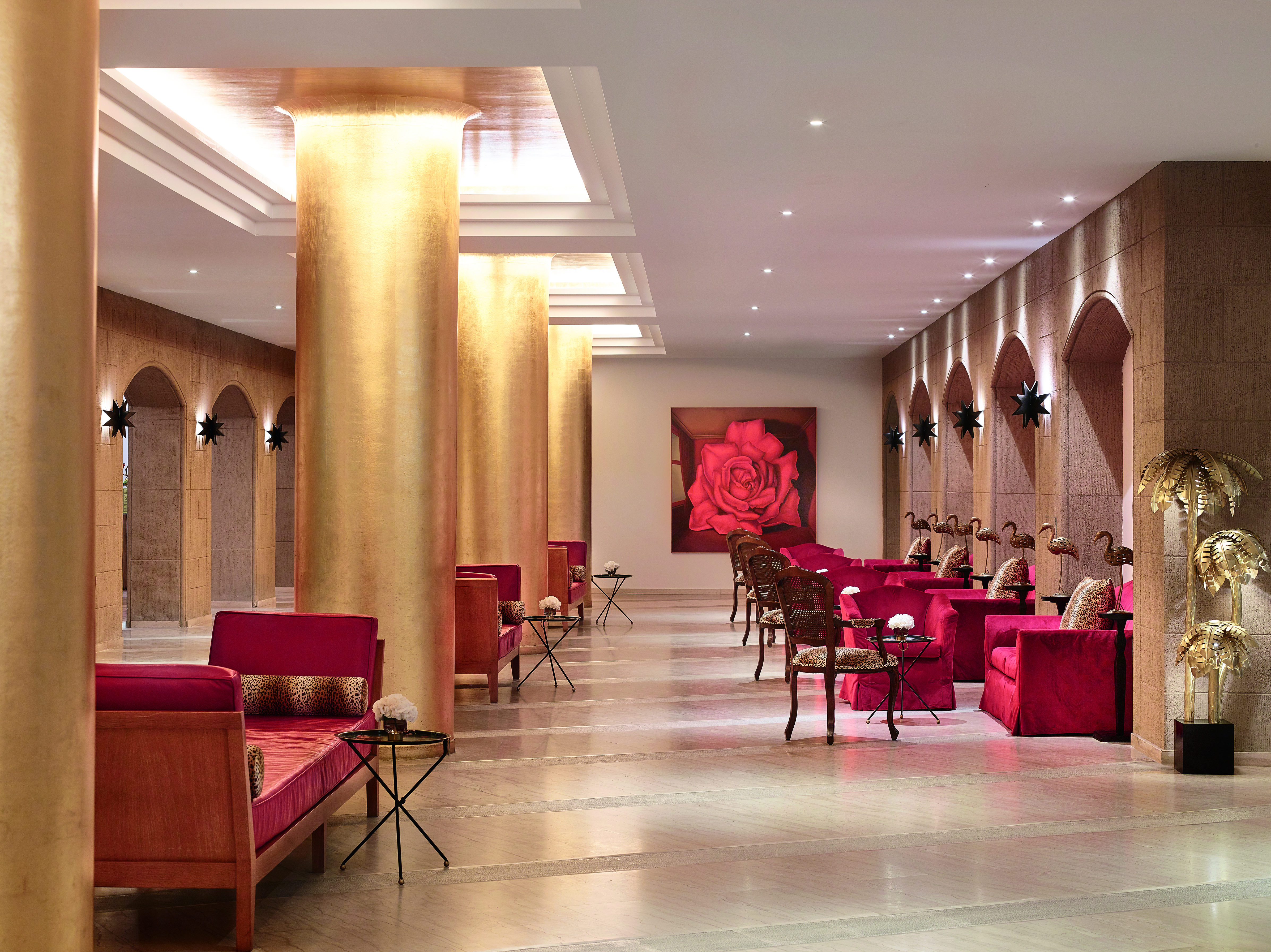 Red seating in lobby with light from overhead