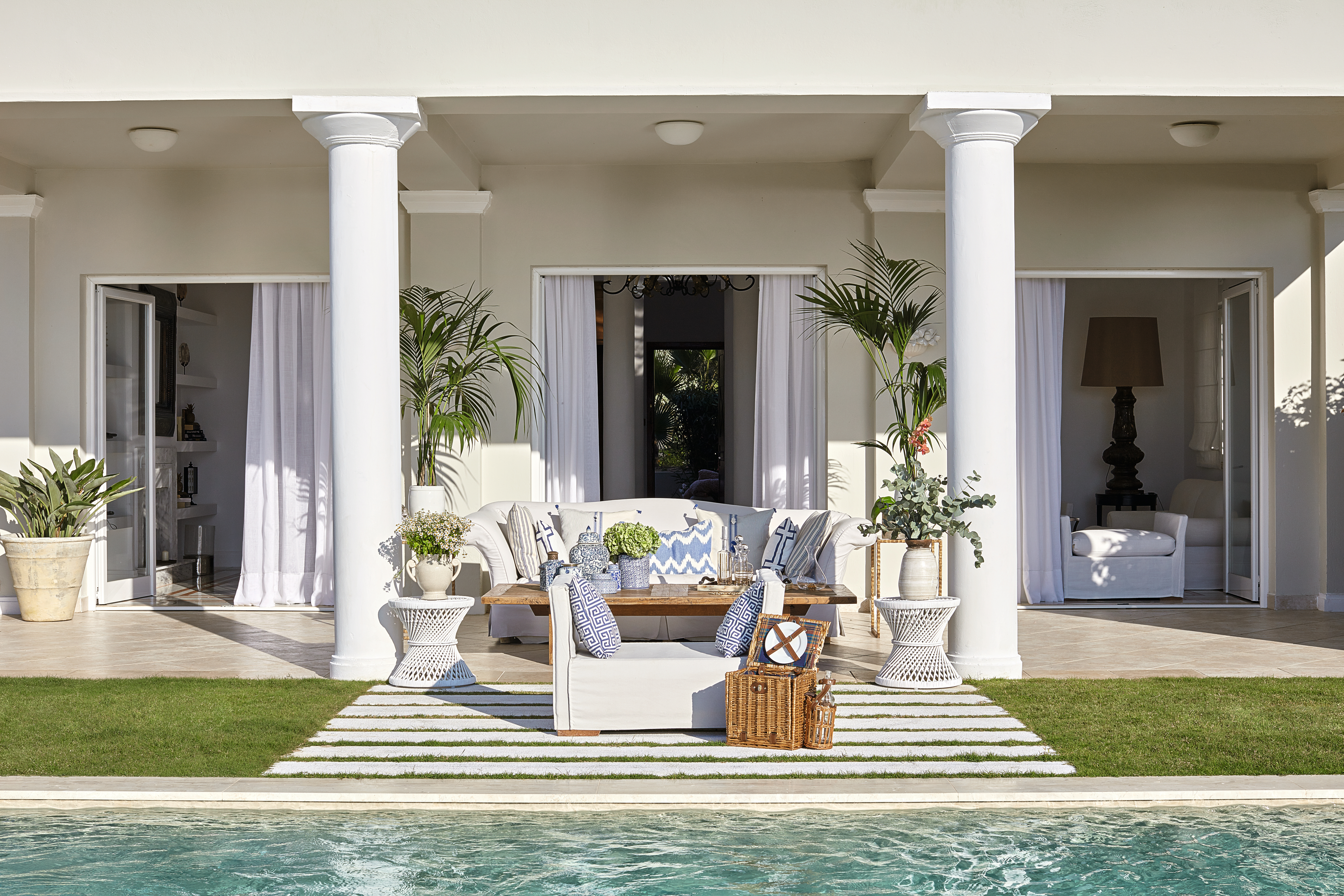 Grecotel Mandola Rosa Greece three bed villa outdoor seating area with sofa table and picnic blanket