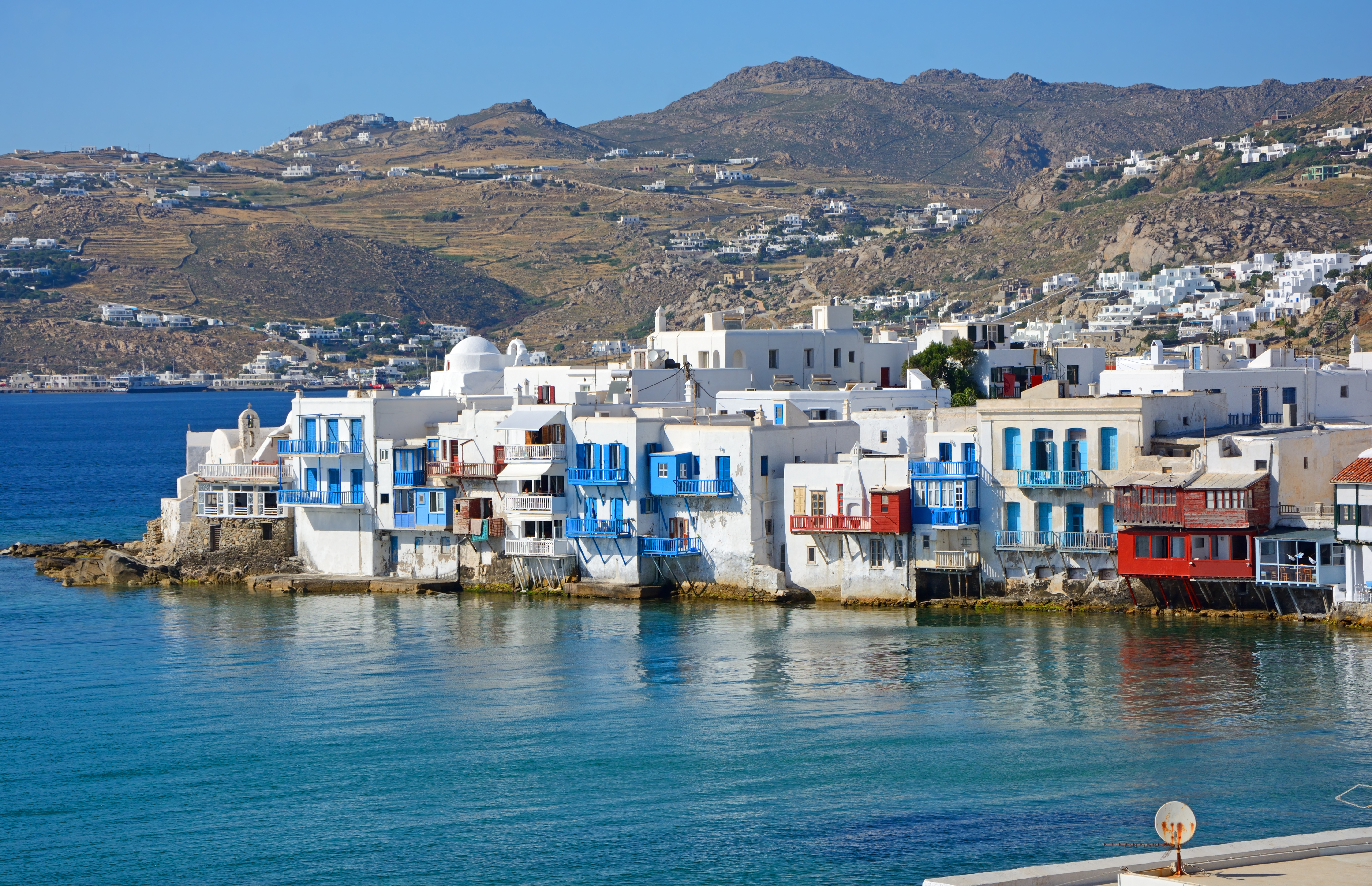 Little Venice in Mykonos, waterfront houses, mountain in background