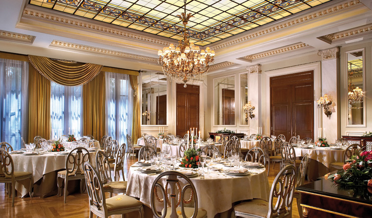 Hotel Grande Bretagne Greece dining room opulent decor chandeliers glass roof 