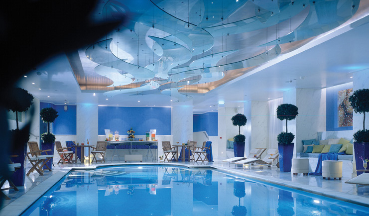 Hotel Grande Bretagne Greece indoor pool loungers seating modern decor