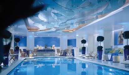 Hotel Grande Bretagne Greece indoor pool loungers seating modern decor