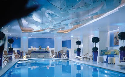 Hotel Grande Bretagne Greece indoor pool loungers seating modern decor