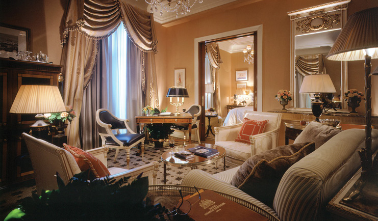 Hotel Grande Bretagne Greece lounge sitting area opulent decor chandelier view of bedroom