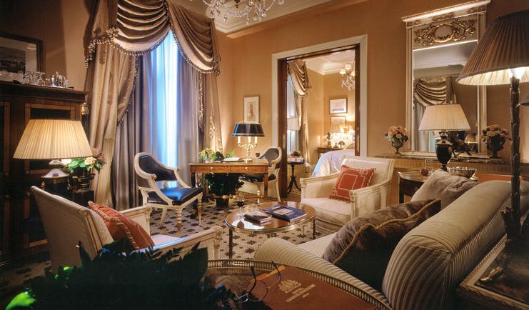 Hotel Grande Bretagne Greece lounge sitting area opulent decor chandelier view of bedroom