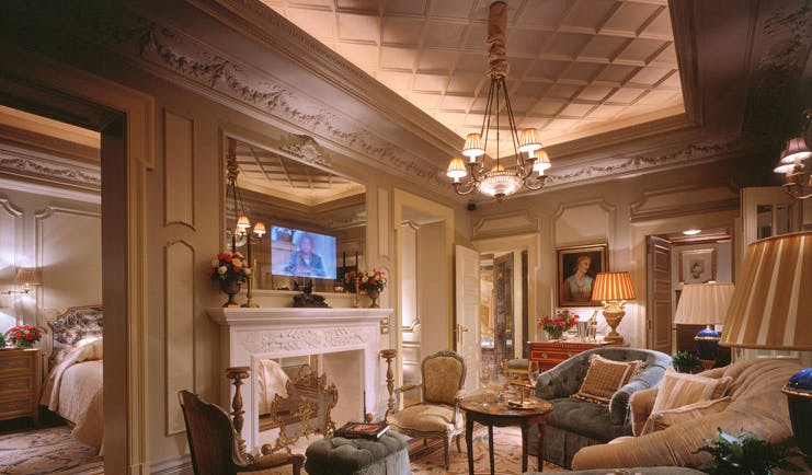 Hotel Grande Bretagne Greece suite lounge sitting area opulent decor fireplace view into bedroom