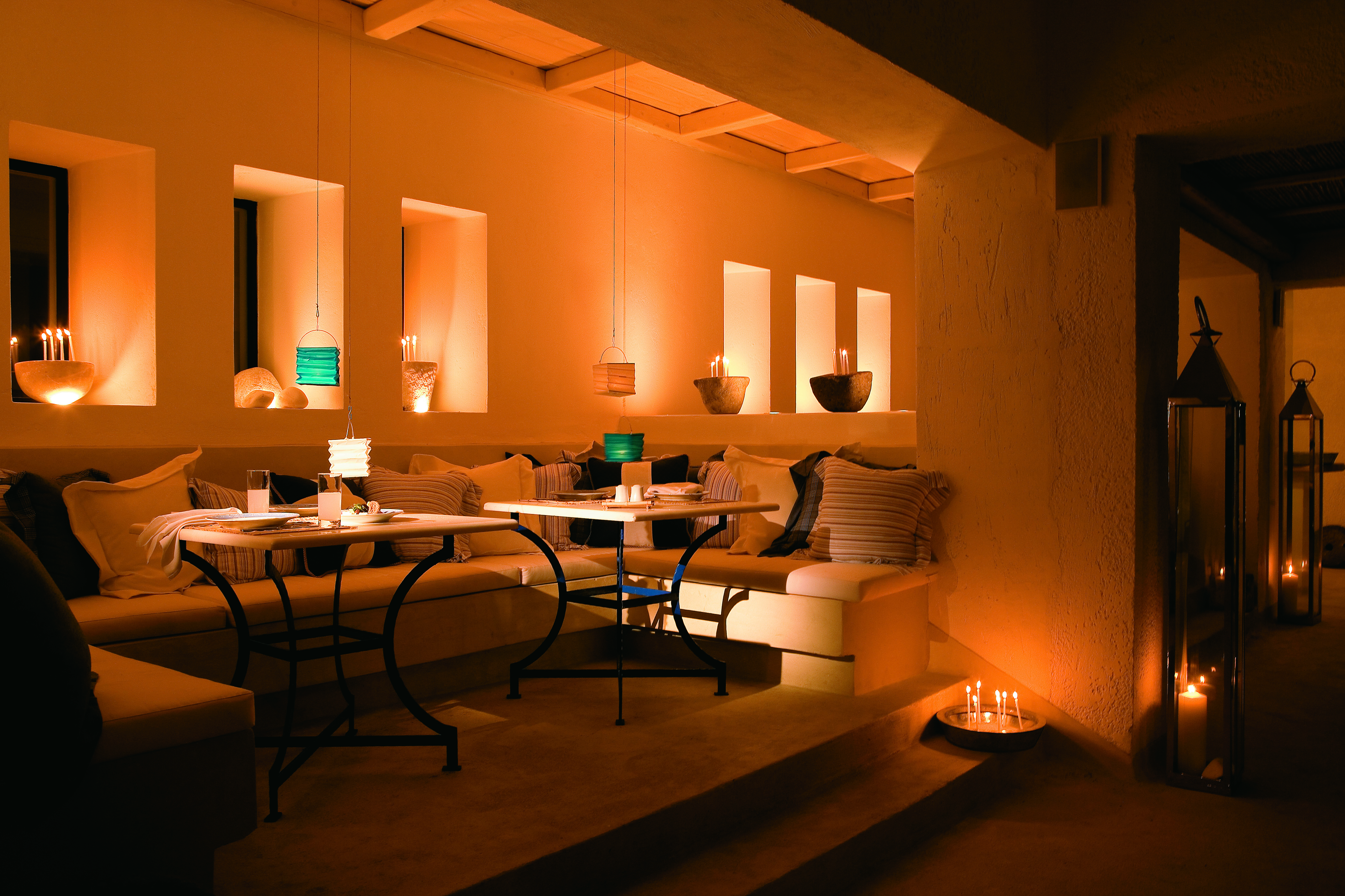 Mykonos Blu Greece Grecotel lounge with sofas and candles 