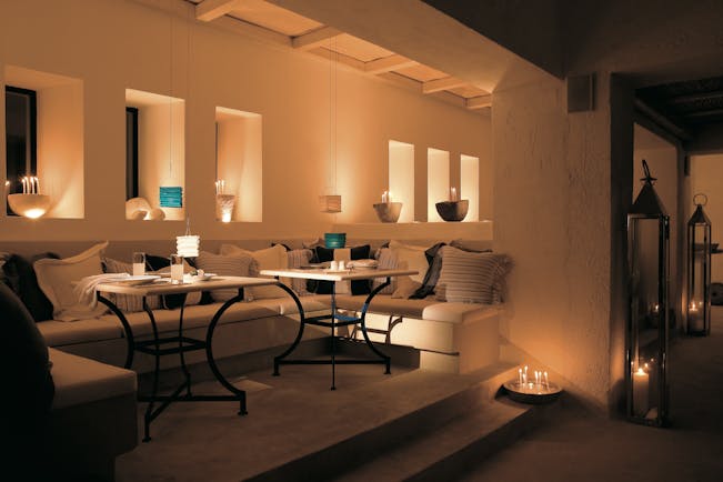 Mykonos Blu Greece Grecotel lounge with sofas and candles 