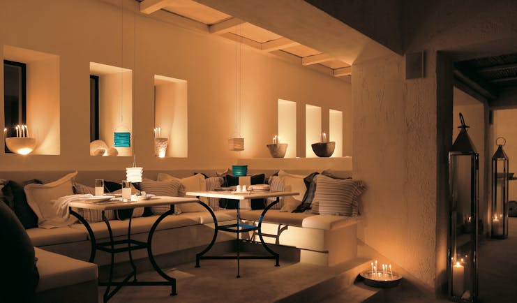 Mykonos Blu Greece Grecotel lounge with sofas and candles 