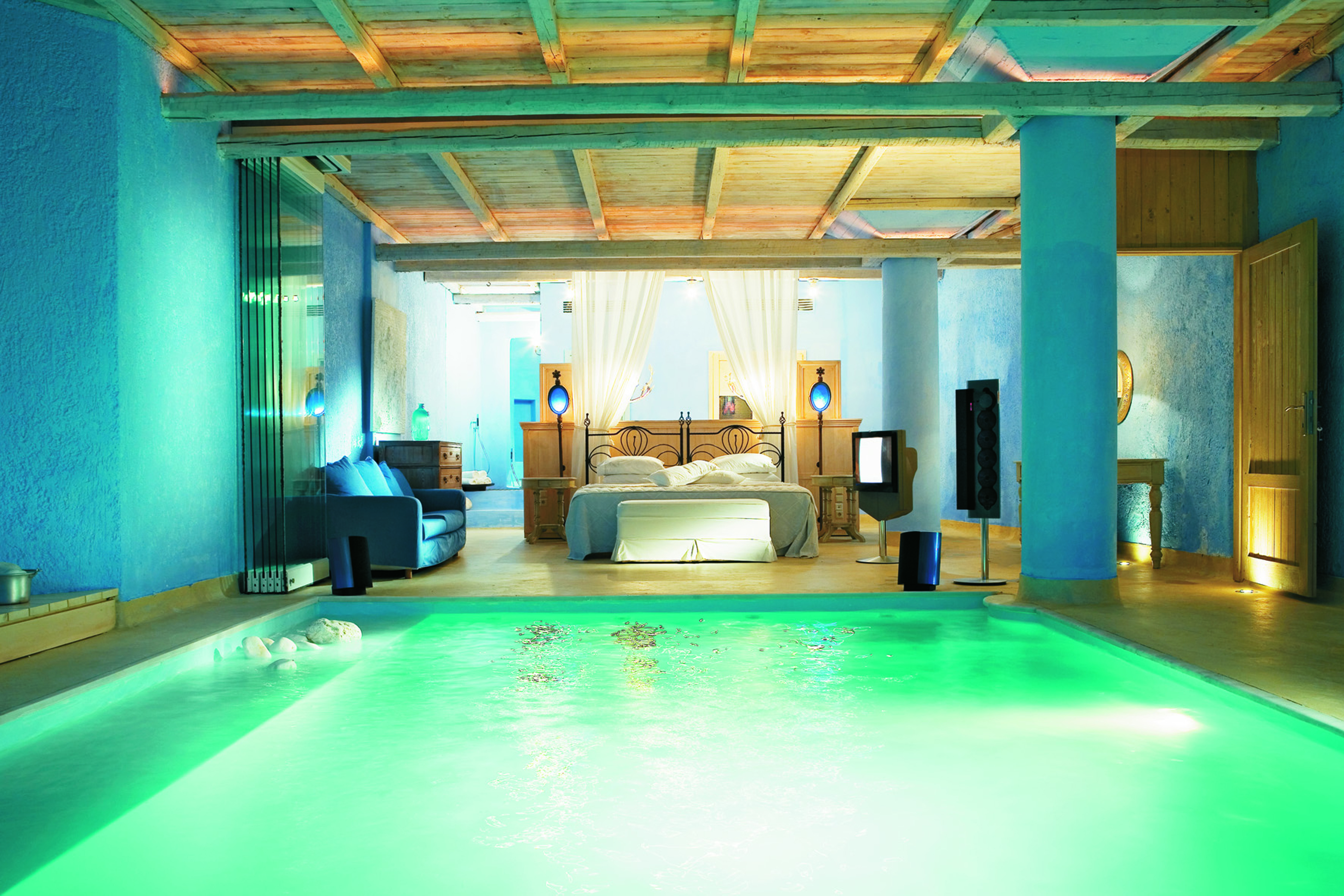 Mykonos Blu Greece Grecotel villa bedroom pool suite with blue walls and wooden roof