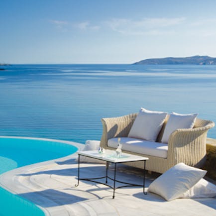 Mykonos Grand Hotel Greece pool sea view small sofa