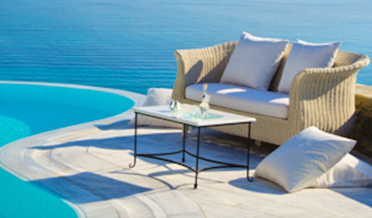 Mykonos Grand Hotel Greece pool sea view small sofa