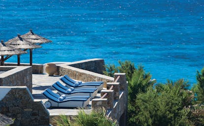 Mykonos Grand Hotel Greece terrace with sun loungers
