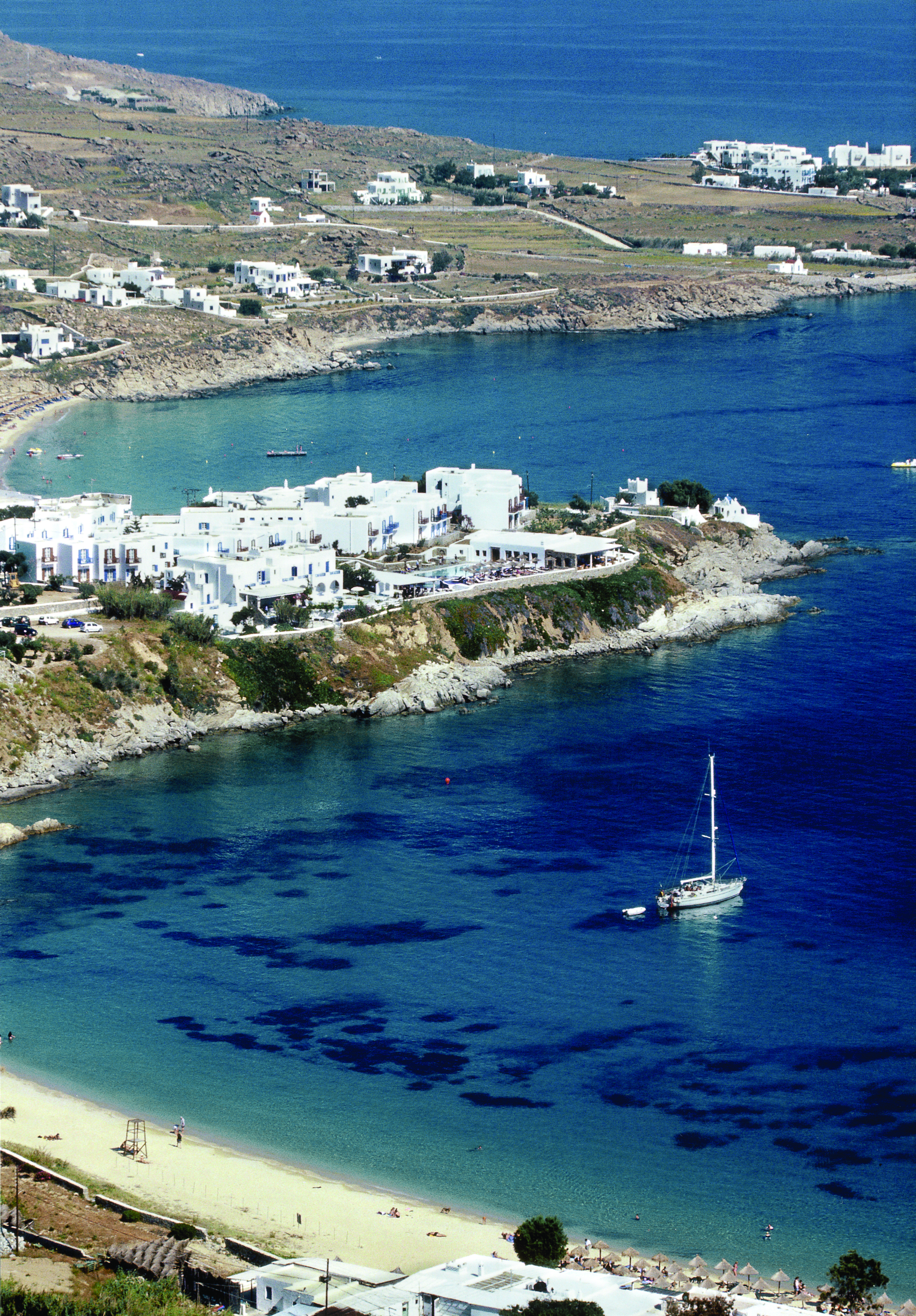 Petasos Beach Resort Greece exterior aerial view of coastline and boat