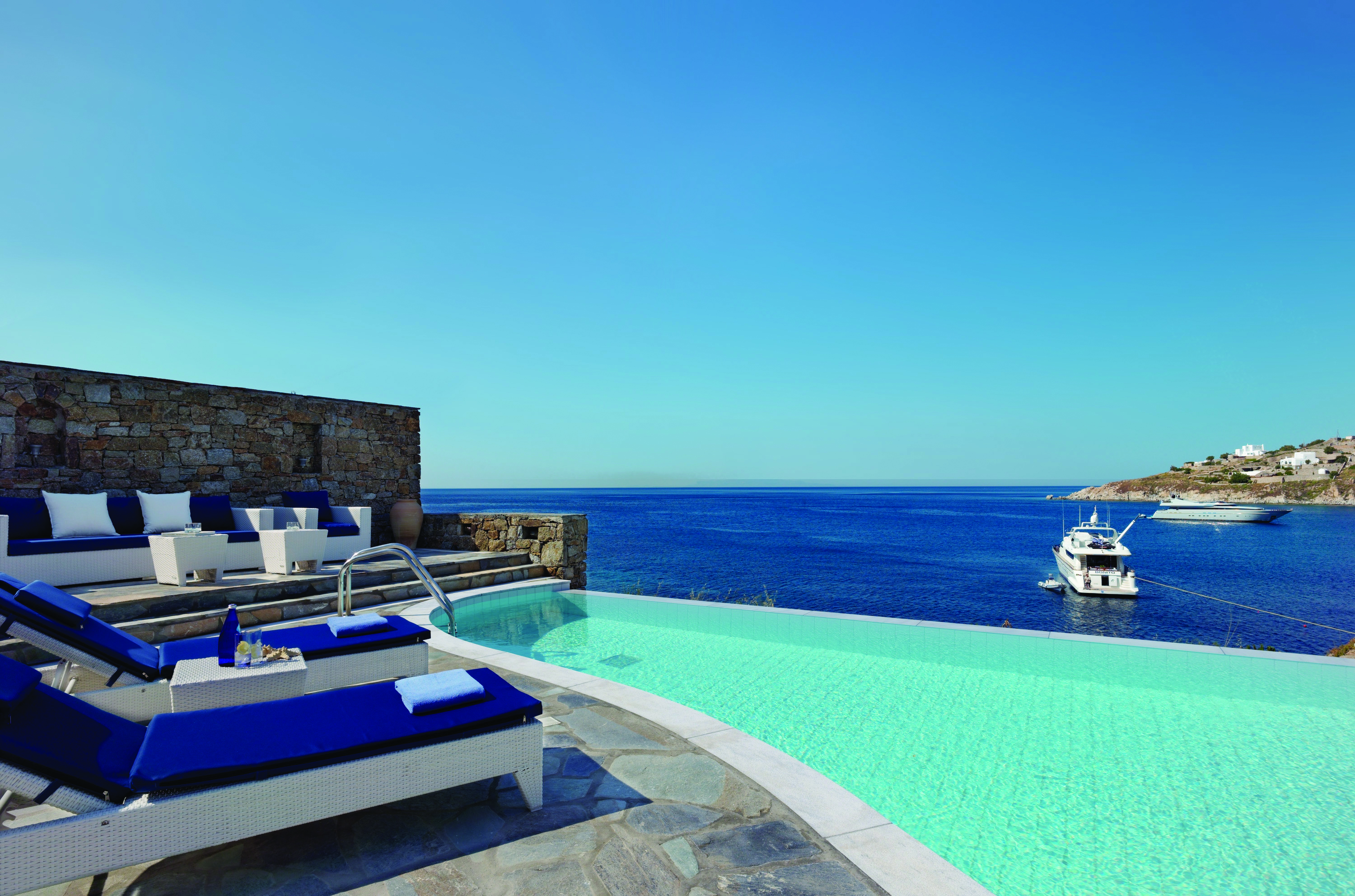 Petasos Beach Resort Greece outdoor pool private with seating area loungers and sea view