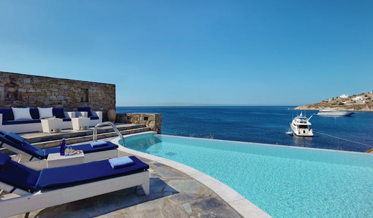 Petasos Beach Resort Greece outdoor pool private with seating area loungers and sea view