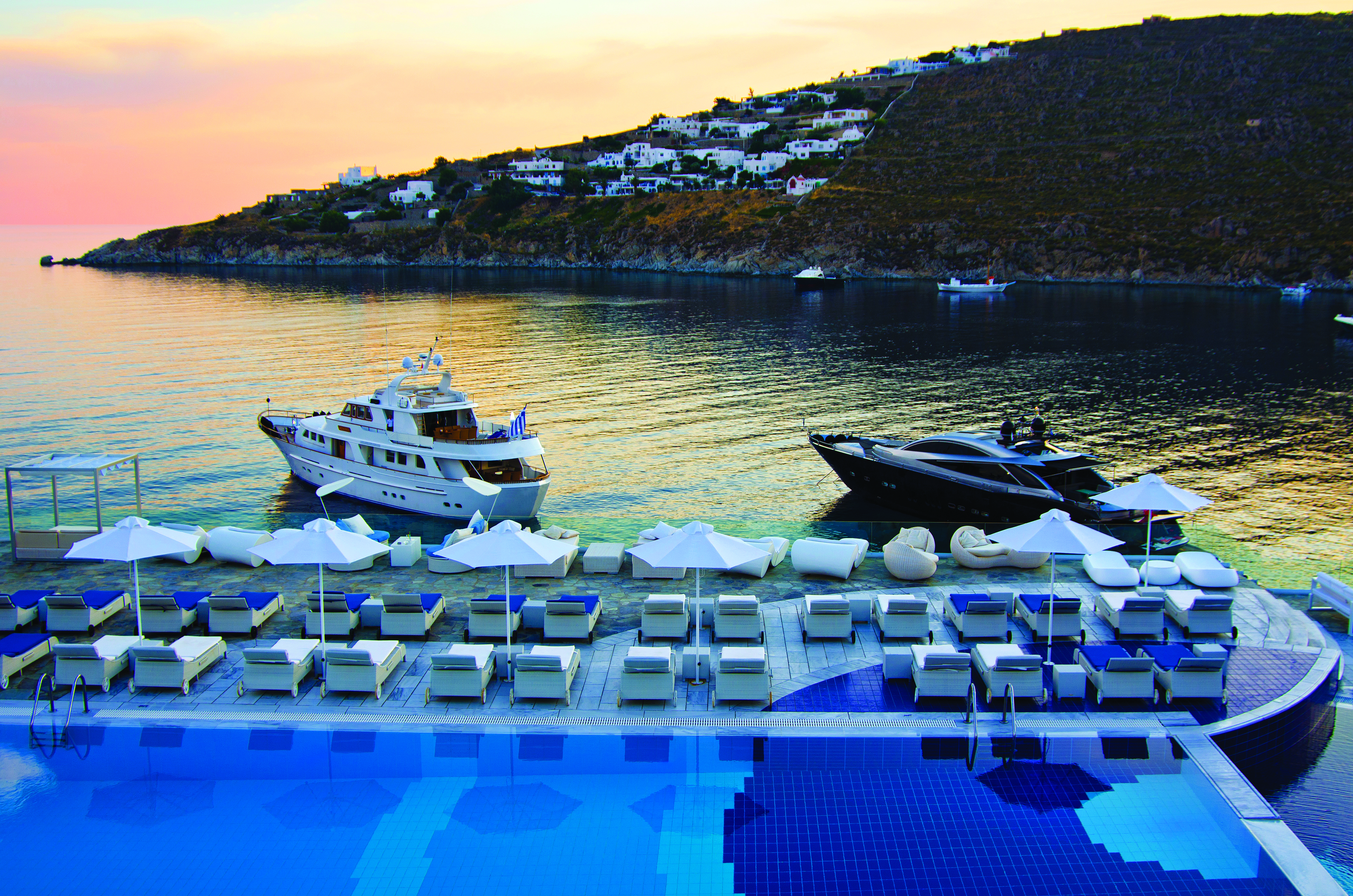 Petasos Beach Resort Greece pool views  loungers and umbrellas sea and yachts