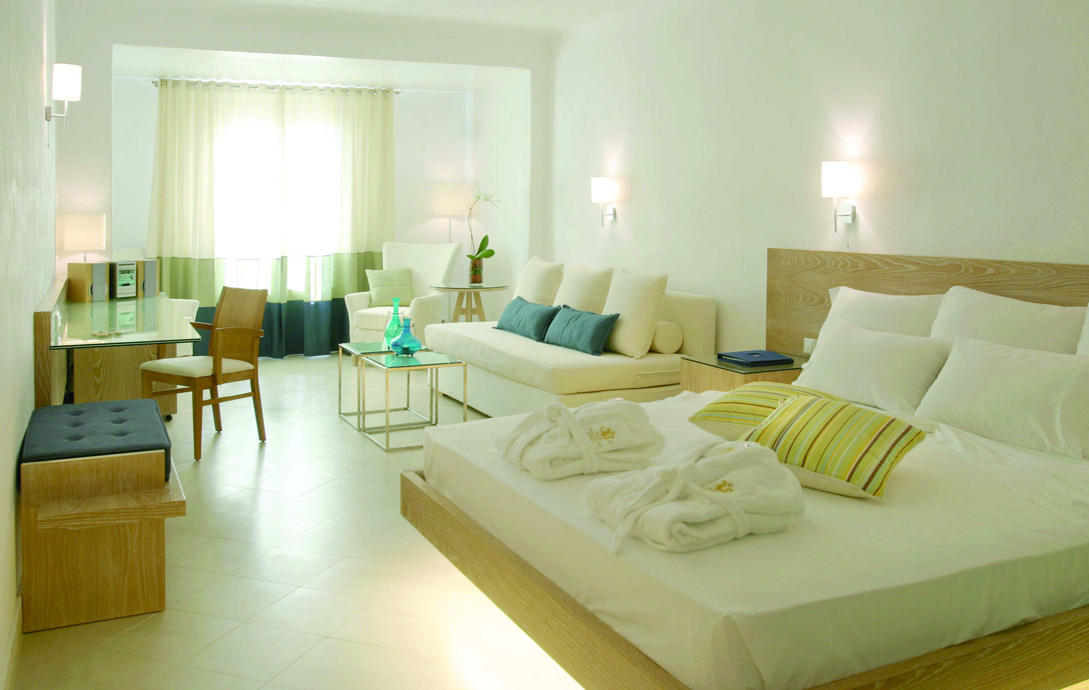 Petasos Beach Resort Greece superior bedroom with white sofa and desk