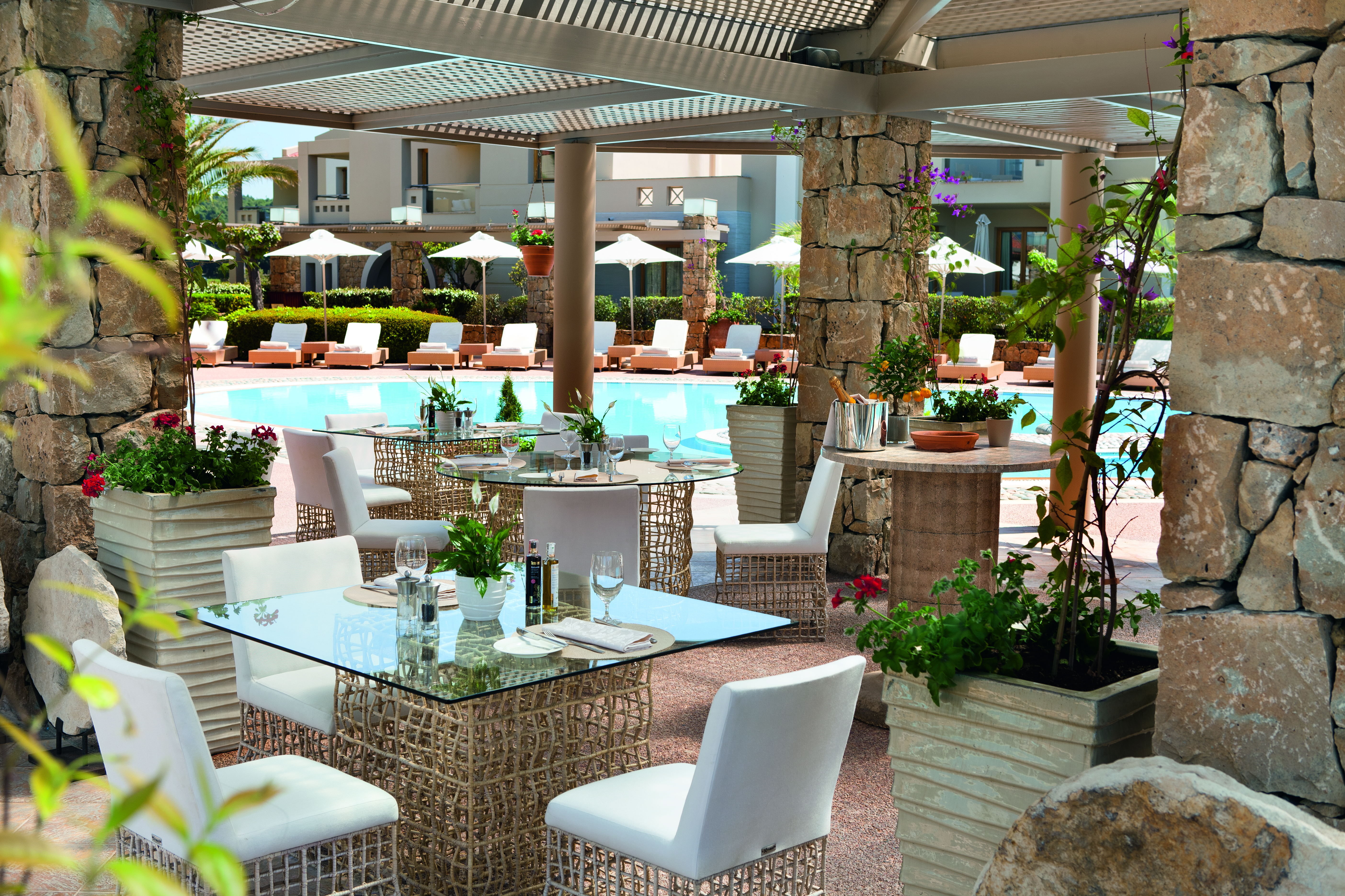 Porto Sani Greece restaurant lagoon outdoor dining area overlooking swimming pool