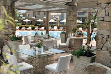 Porto Sani Greece restaurant lagoon outdoor dining area overlooking swimming pool