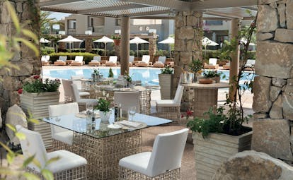 Porto Sani Greece restaurant lagoon outdoor dining area overlooking swimming pool