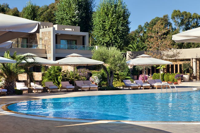 Sani Asterias Greece outdoor pool with sun loungers and umbrellas