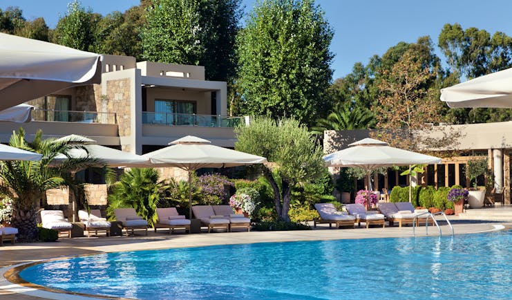 Sani Asterias Greece outdoor pool with sun loungers and umbrellas
