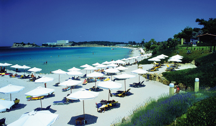 Sani Club Greece beach loungers umbrellas white sand gardens