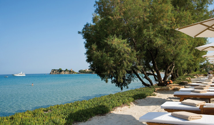 Sani Club Greece beachfront loungers umbrellas grass beach ocean