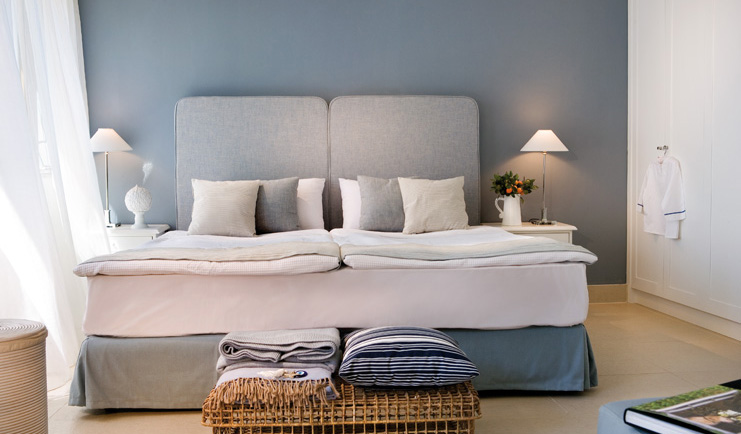 Sani Club Greece family bedroom minimalist decor wicker basket blankets