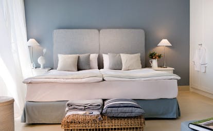 Sani Club Greece family bedroom minimalist decor wicker basket blankets