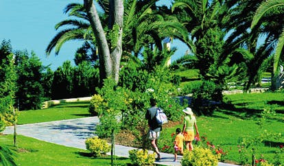 Sani Club Greece gardens family walking through paths flowers palm trees