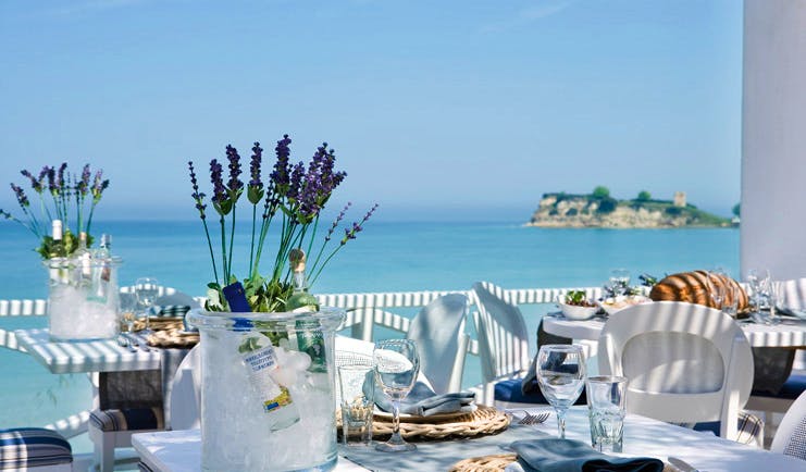 Sani Club Greece Ouzerie outdoor dining Ouzo on ice lavender sea view
