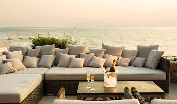Sani Club Greece dunes outdoor lounge area sofa champagne sea view