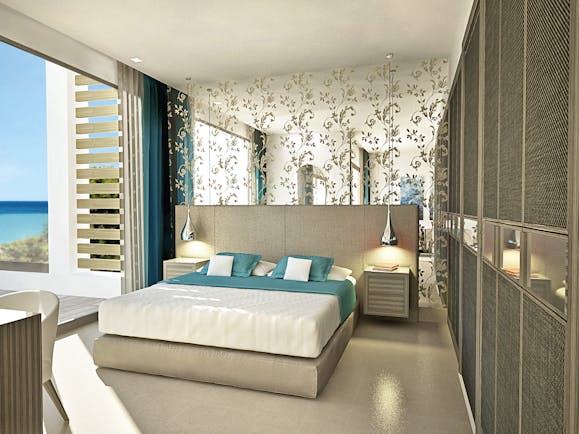 Sani Dunes Greece junior suite beach front bedroom with patterned mirror and terrace