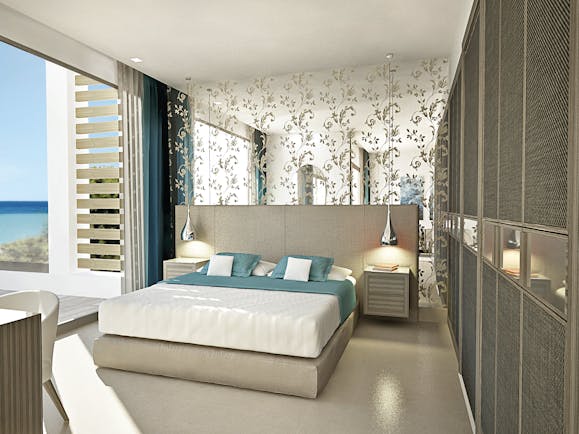 Sani Dunes Greece junior suite beach front bedroom with patterned mirror and terrace