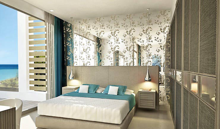 Sani Dunes Greece junior suite beach front bedroom with patterned mirror and terrace