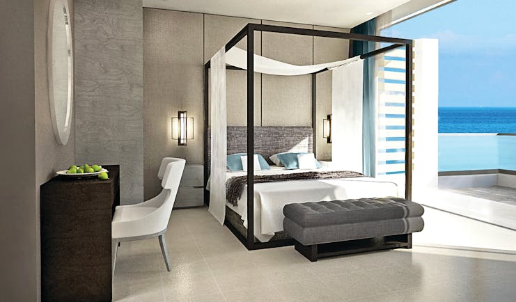 Sani Dunes Greece junior suite sea view bedroom with four poster bed and balcony