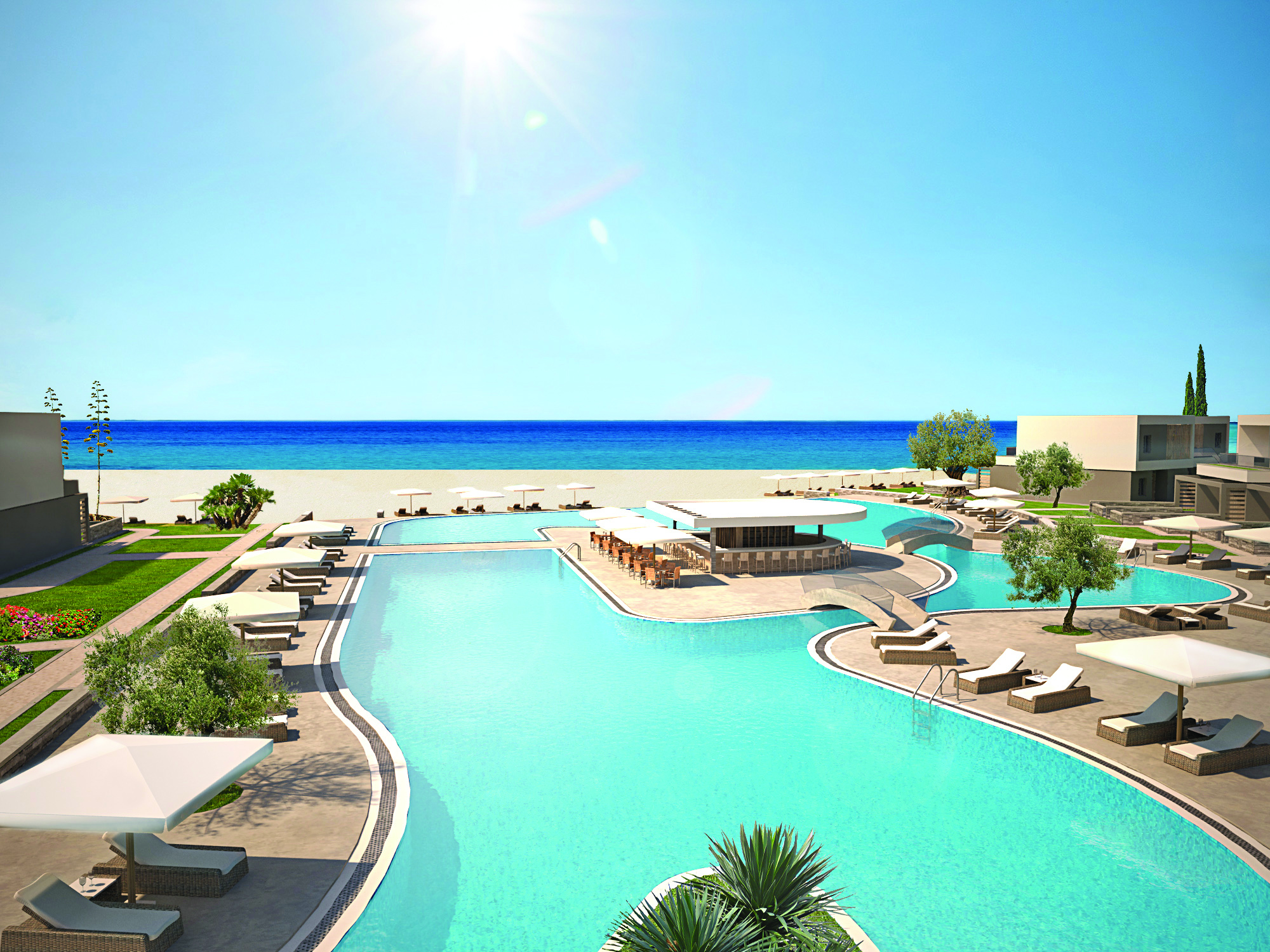 Overview of the pool at Sani Dunes with sunbeds and umbrellas surrounding the pool and leading onto the beach 