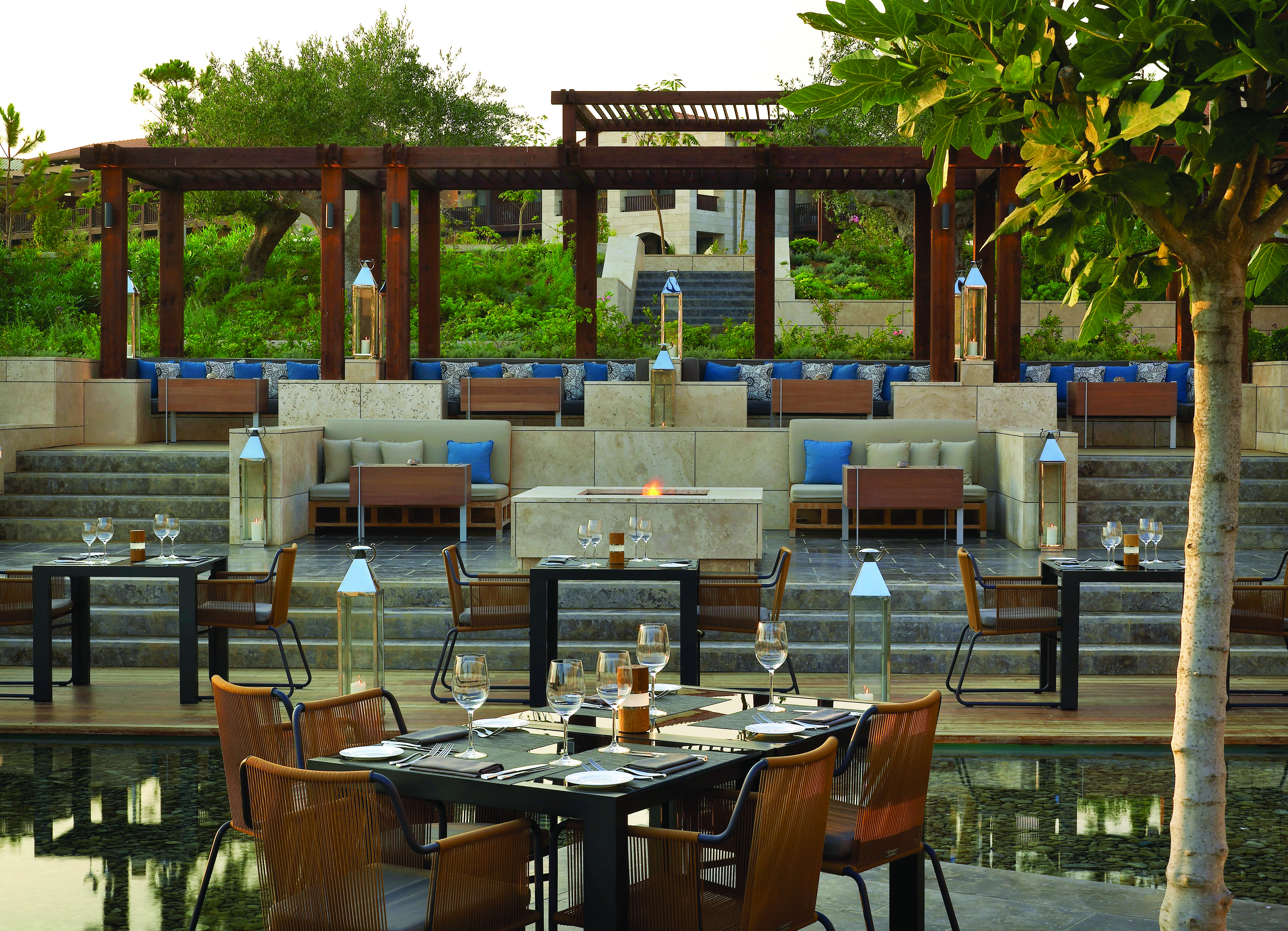 The Romanos Greece outdoor dining restaurant stepped seating area overlooking dining area 