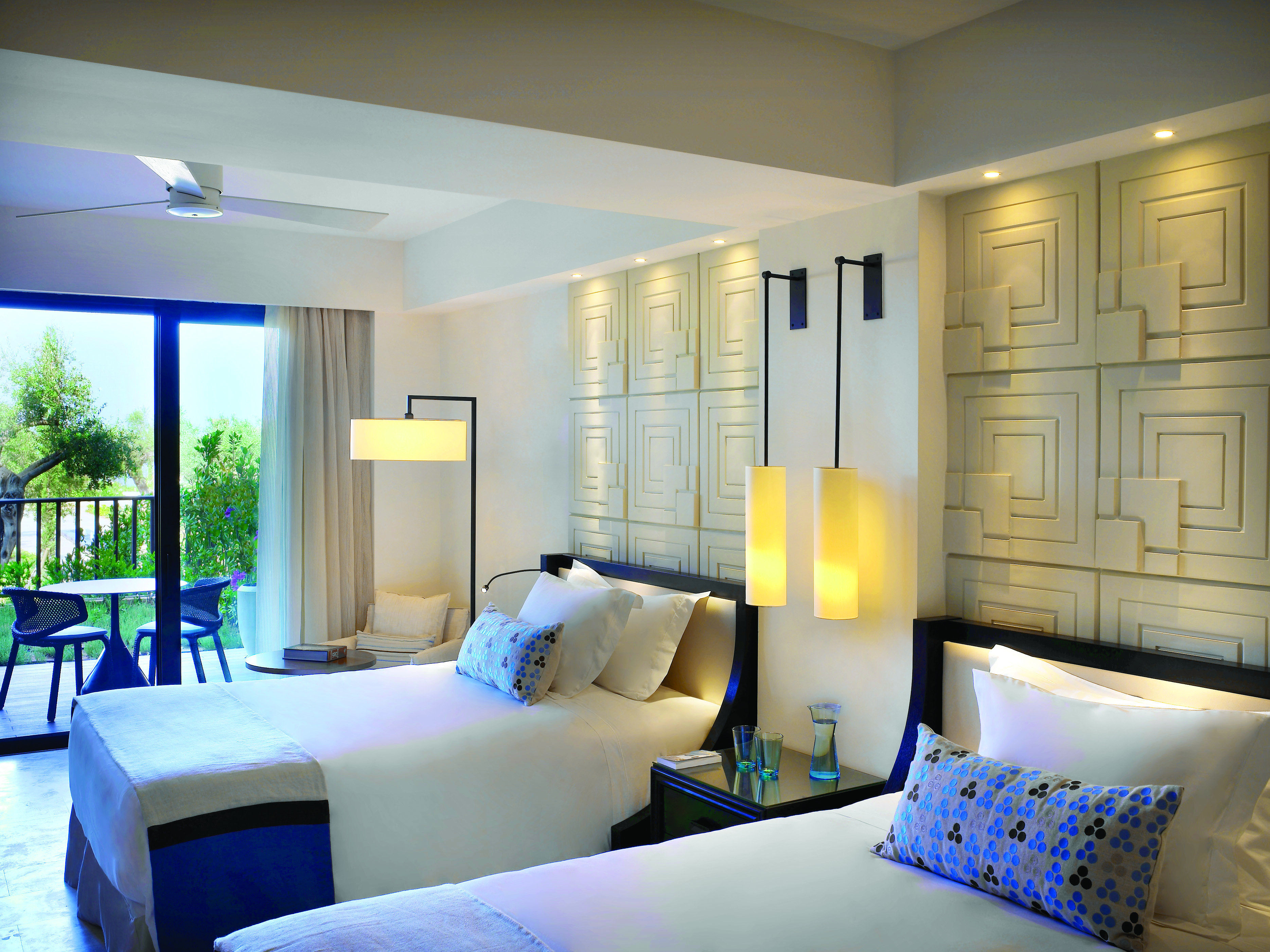 The Romanos Greece twin bedroom balcony garden