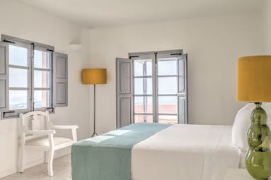 Vedema Resort Greece Dorian suite bedroom with window and grey shutters and patio doors