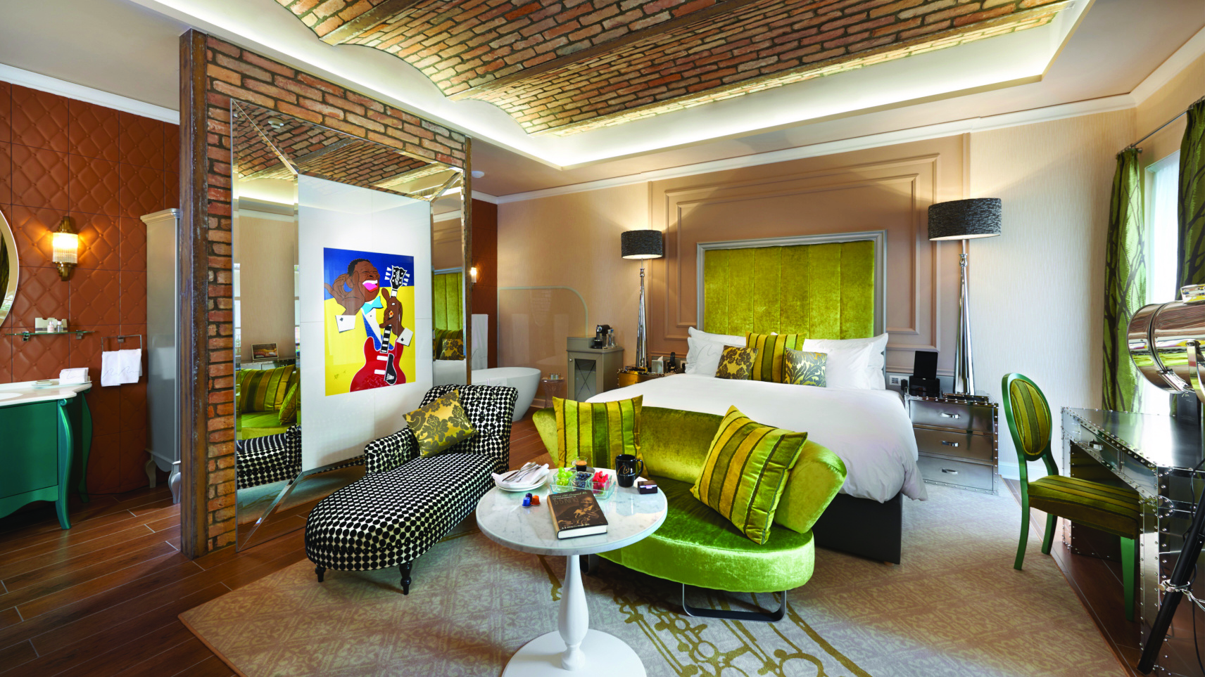 Aria Hotel Budapest bedroom brick feature wall chaise longue sofa table desk 